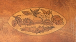 detail of lid of a satin-birch tea caddy ...